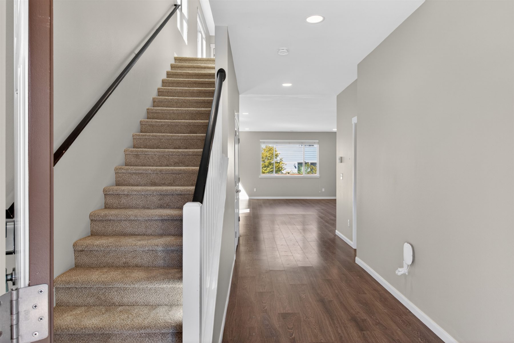 Entryway and stair detail photographed for a real estate listing