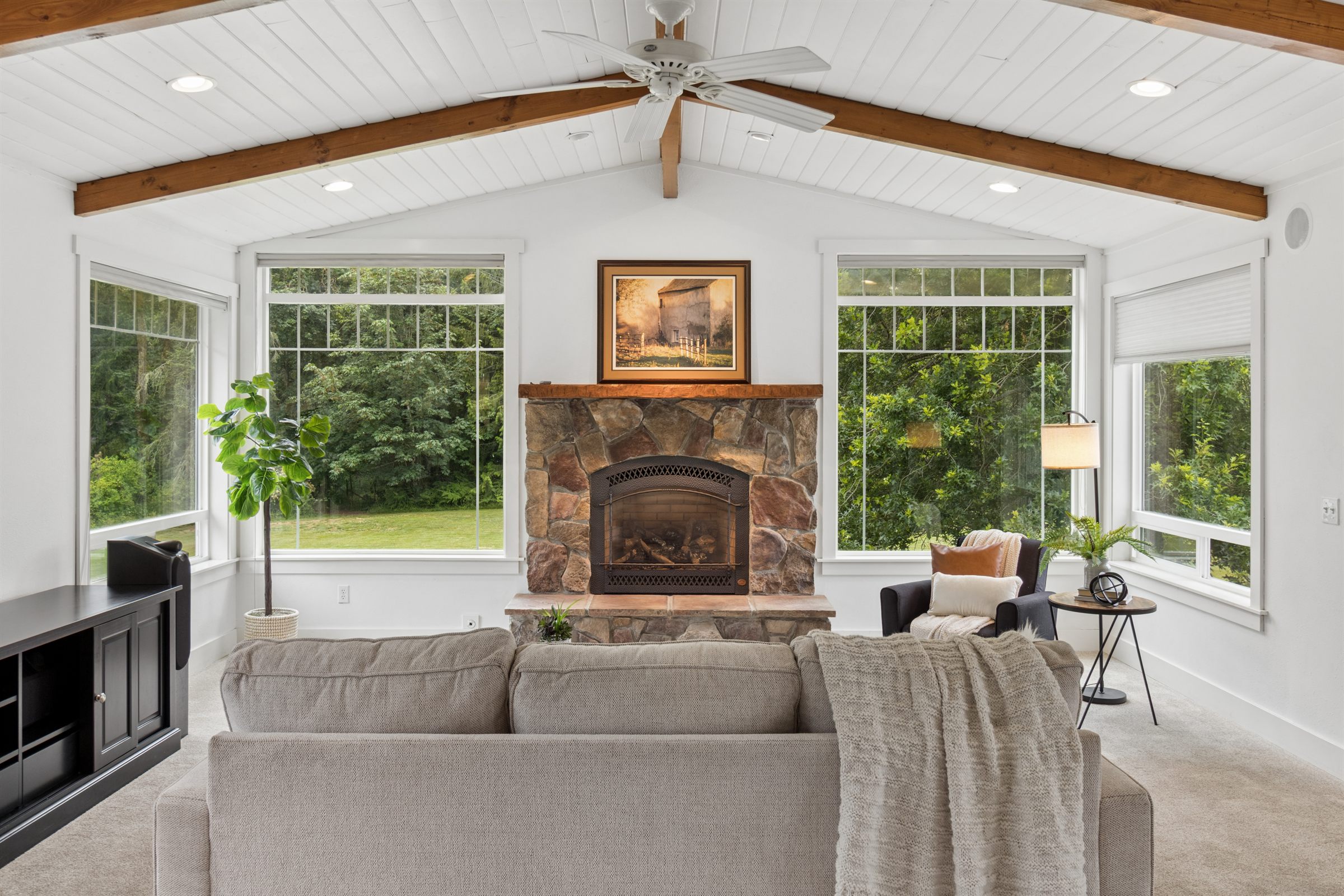 Bright living room with fireplace photographed for a real estate listing