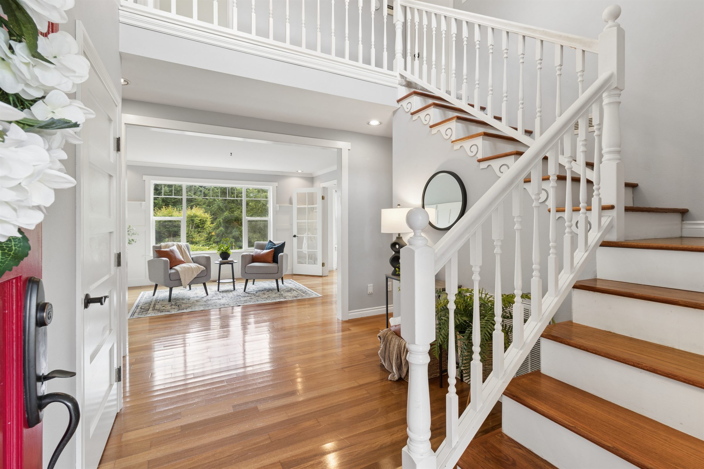 Entryway and staircase photographed for a real estate listing