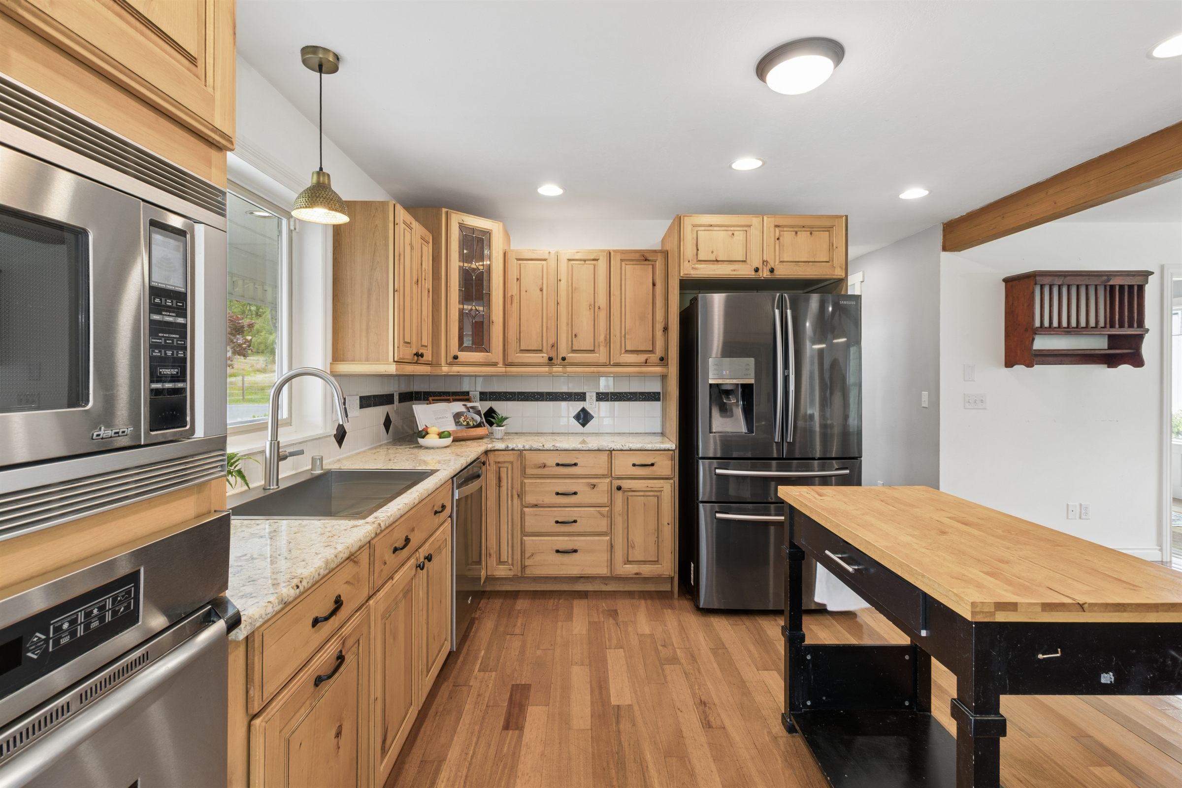 Kitchen island and cabinetry photographed for a property listing